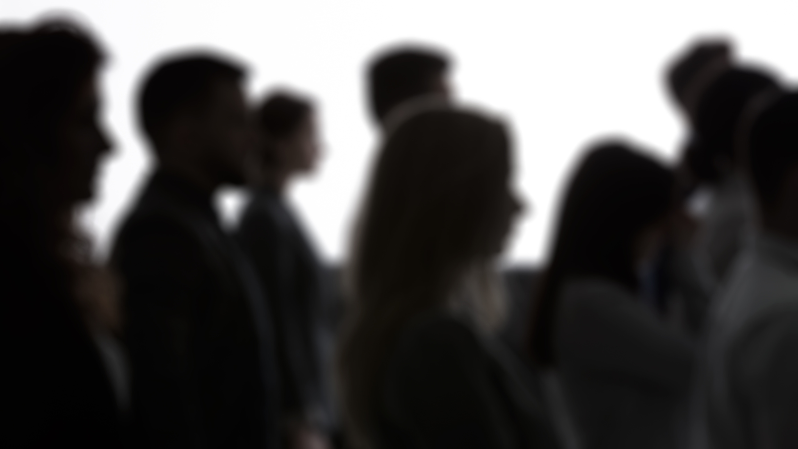 people shadows crowd facing right